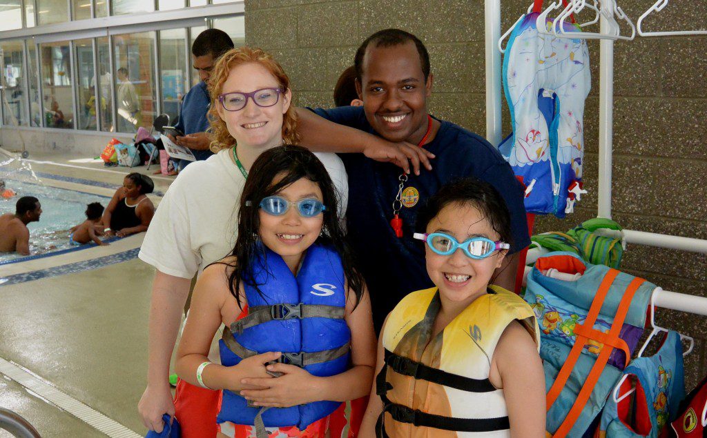 Children practice wearing life jackets.