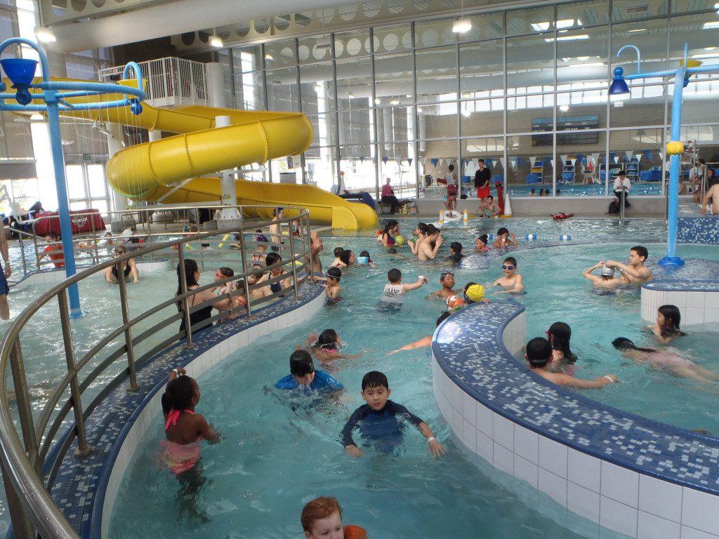 Children play in the lazy river during April Pool's Day.