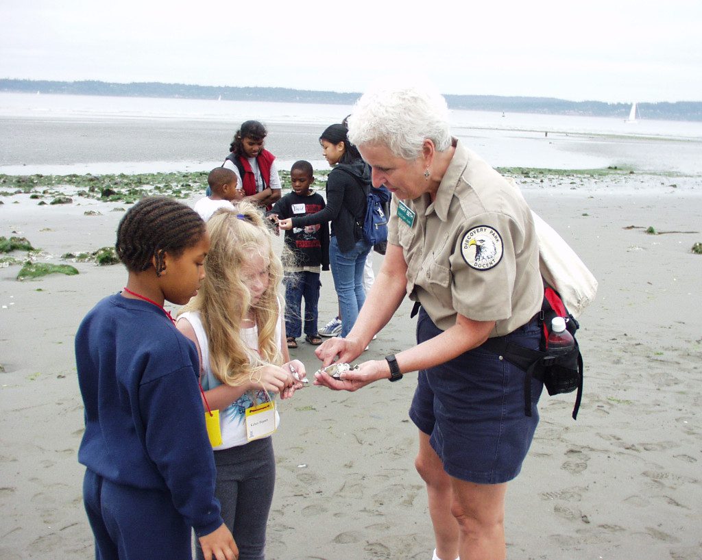 Kids and nature docent on beach in Discovery Park