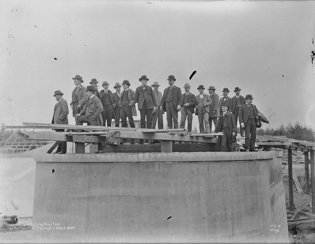 Volunteer Park Reservoir under construction, official inspection tour by City Council, May 1900.
