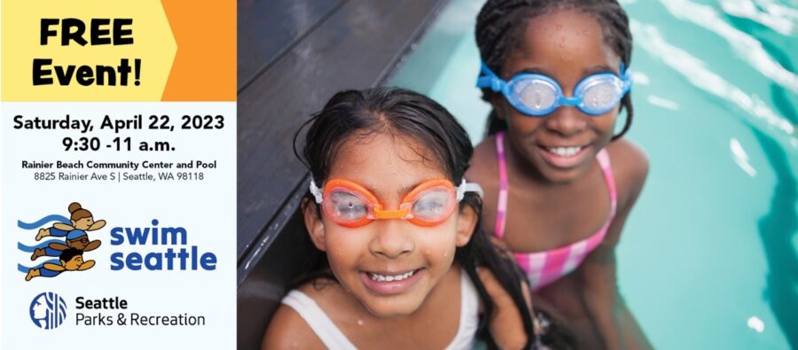 Photo of two young girls wearing swim goggles at the side of a pool, smiling at camera