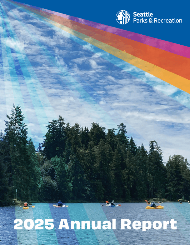 Front cover aof a report with the words "2025 Annual Report" over an image of people kayaking on water along a shore full of trees.